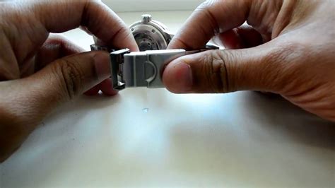 how to open omega watch clasp